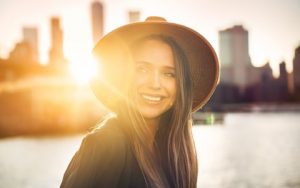 A young woman smiling after bite optimization.